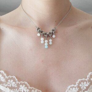 Vintage antique V-shaped pearl necklace with a small silver chain